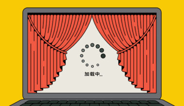 A laptop with red curtains revealing a loading screen