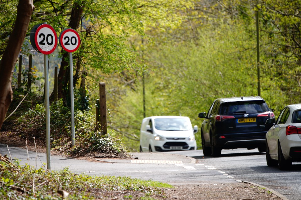 20 mph speed limit signs on a road in Wales.