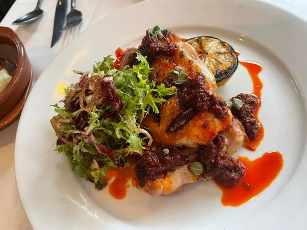 Grilled chicken thighs with Calabrian 'ndjua glaze, radicchio salad and peperonata