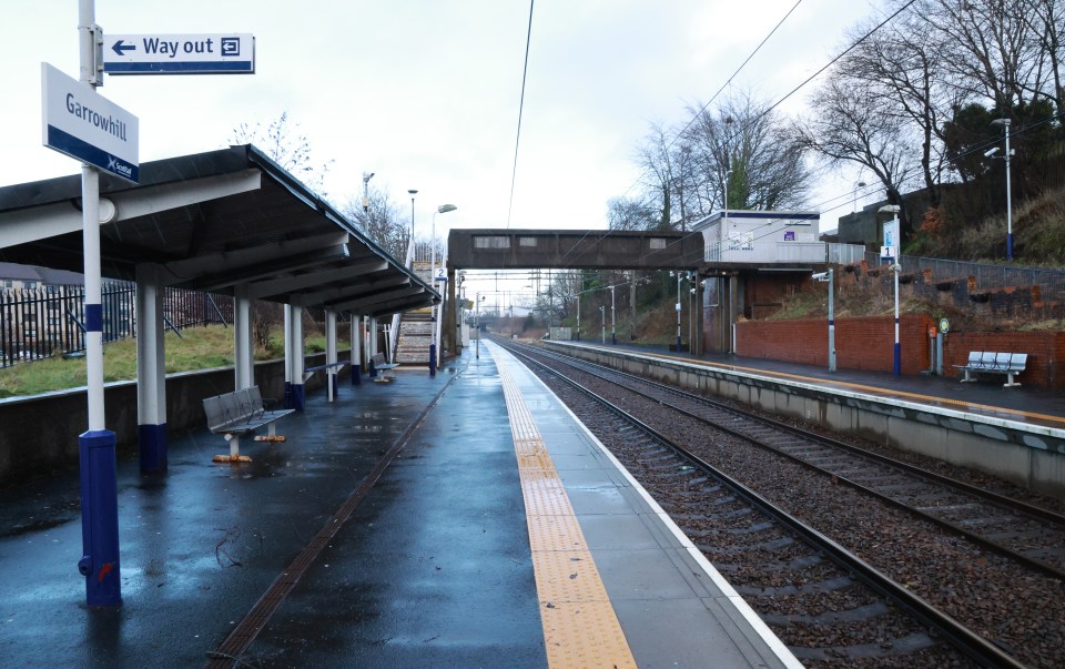 Garrowhill train station platform on a rainy day.