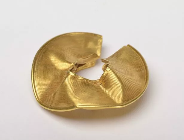 A Rossett lock ring damaged and crumpled.