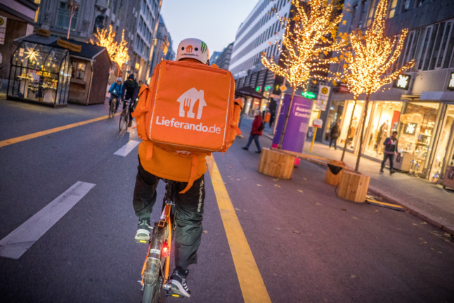 A delivery ride on a bike.