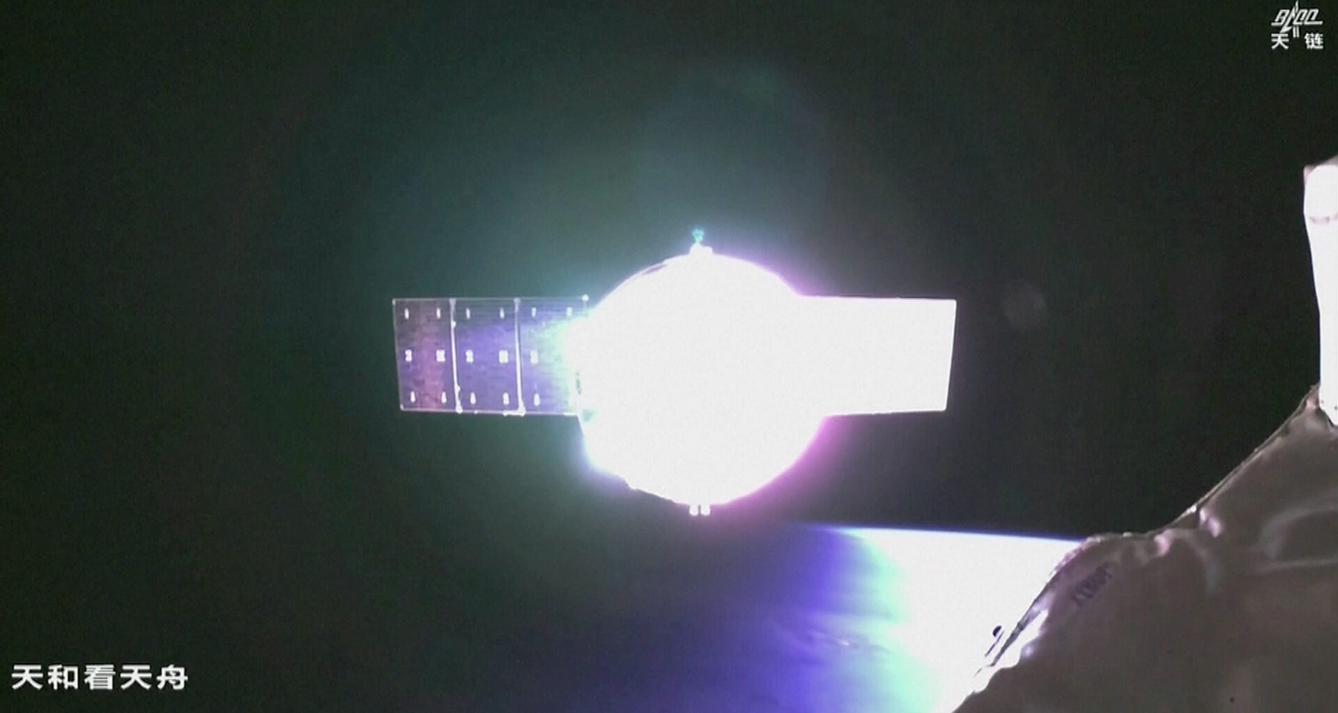 A space craft reflects light in the darkness of space