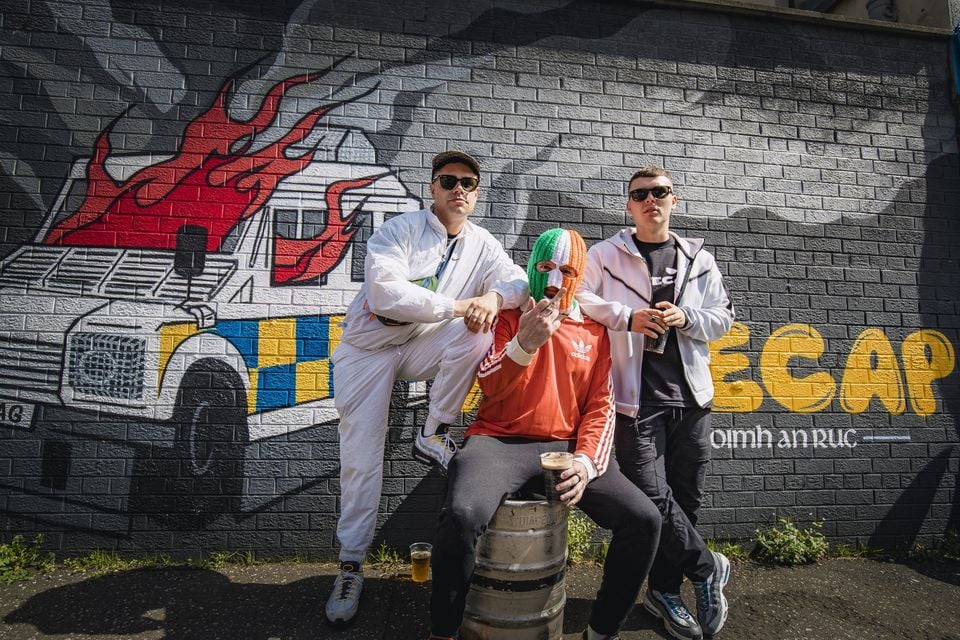 Feile 35...Kneecap unveil a new mural in the Hawthorn Street area of west Belfast on August 11th 2023 (Photo by Kevin Scott)