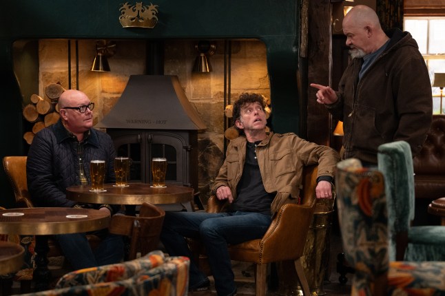Bear, Paddy and Marlon chat in the pub in Emmerdale
