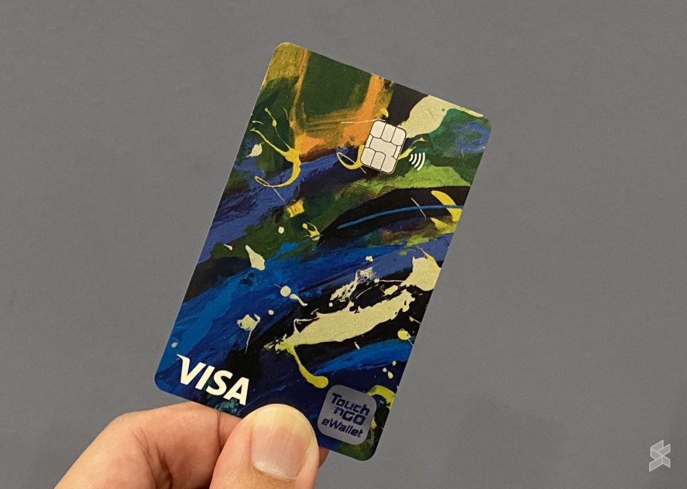 The TNG eWallet comes with a Visa card that allows migrant workers to remit money home. — SoyaCincau pic