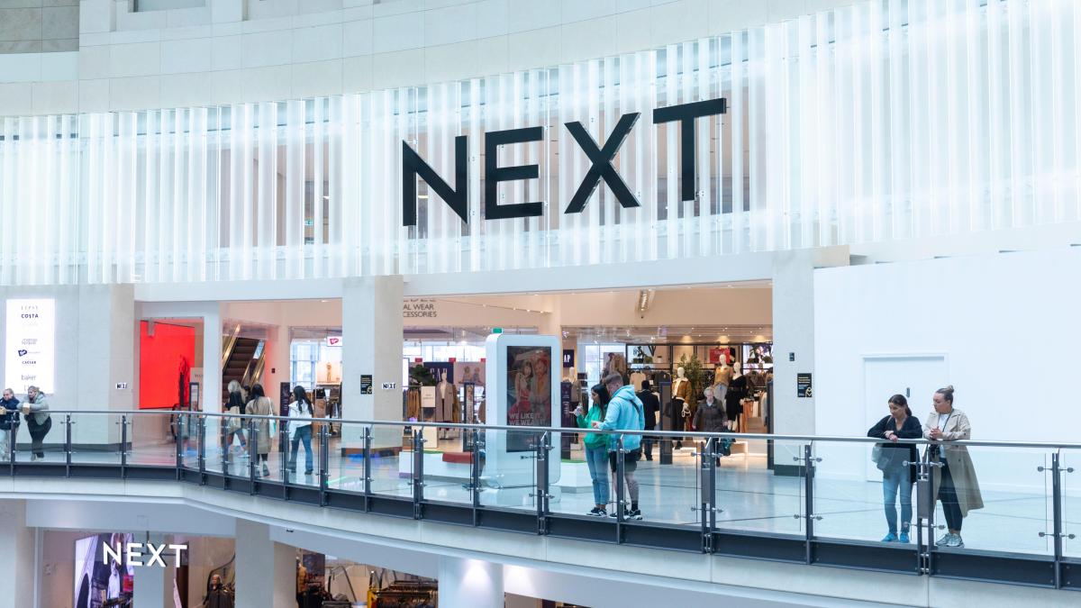 Next raises profit guidance but warns higher taxes will weaken spending