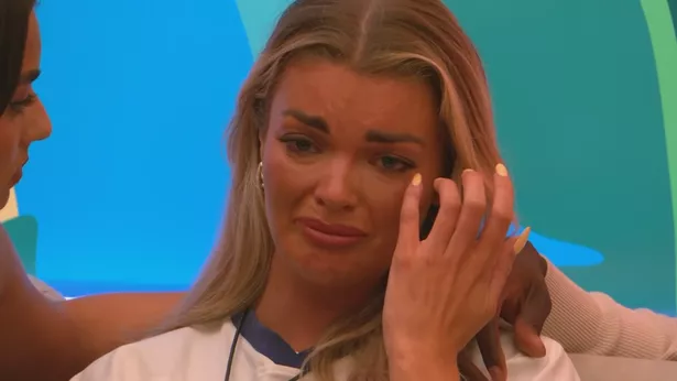 Young blonde woman crying 