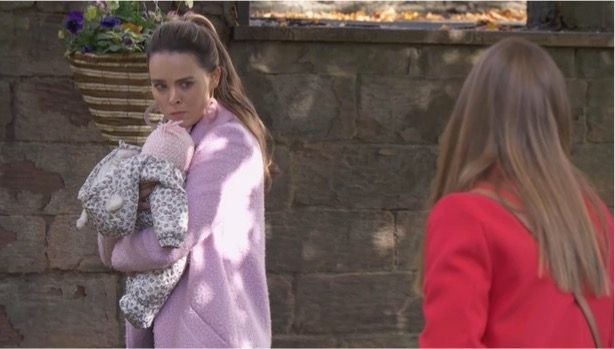 Hollyoaks character Liberty holding baby Faith