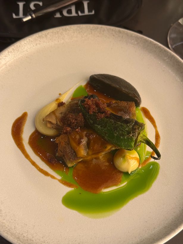 One of the courses served on a plate at the restaurant