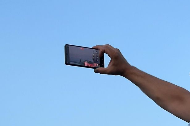 Fans zoomed in on their phones after climbing the walls around the perimeter of the park