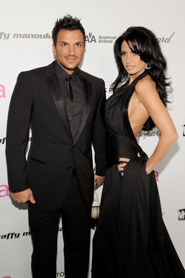 Singer Peter Andre and TV personality Katie Price posing for a photo wearing all black outfits 