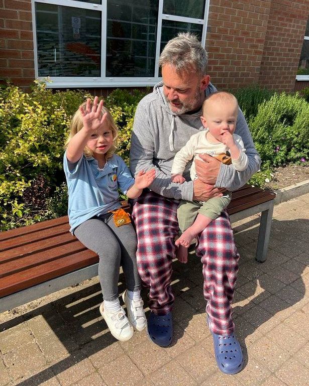 A man with his two children