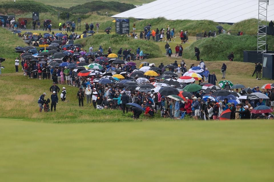 Spectators at The Open in Royal Portrush have faced heavy showers this week. Photo: Desmond Loughery/Pacemaker