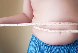 Boy measuring weight.