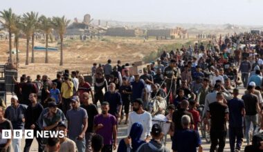 Image shows Palestinians seeking aid near an aid distribution site run by the Gaza Humanitarian Foundation in Rafah, the southern Gaza Strip, on 27 May 2025