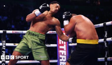 Leo Atang (left) hits Milen Paunov with a bodyshot