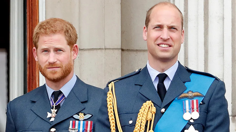 Prince Harry and Prince William in uniform outside Buckingham Palace