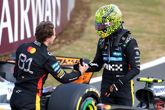 Piastri congratulates Lando Norris after the Brit won his home grand prix for the first time.
