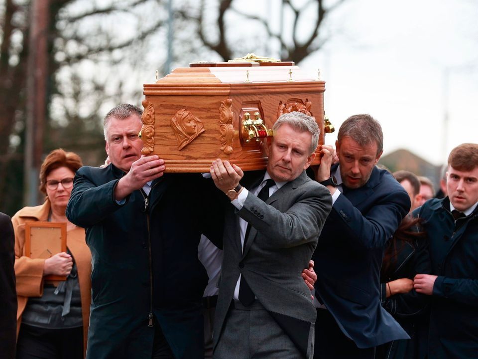 Patrick Kielty (right) carries the coffin of his mother, Mary