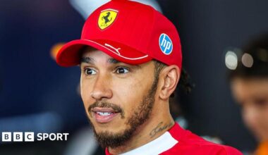 Lewis Hamilton speaking to the media at the Austrian Grand Prix wearing a Ferrari cap