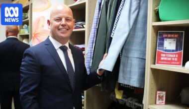 Nurse Keith Donnelly opens communal wardrobe for hospital mental health patients