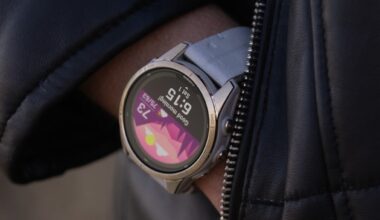 Garmin Fenix 7 Pro smartwatch on wrist with hand in coat pocket