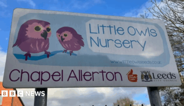 A Little Owls Nursery sign. Two cartoon owls are illustrated alongside the title, with 'Chapel Allerton' written underneath. A Leeds City Council logo can be seen on the far left, at the bottom of the sign.