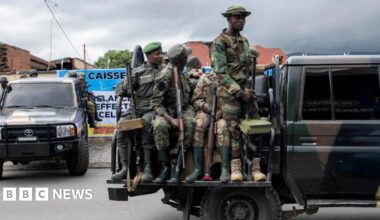 Peace mediator Sumbu Sita Mambu, a high representative of the head of state in the Democratic Republic of Congo (L), and Rwanda-backed armed group M23 executive secretary Benjamin Mbonimpa (R)