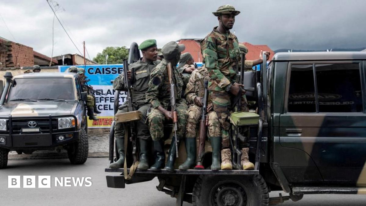 Peace mediator Sumbu Sita Mambu, a high representative of the head of state in the Democratic Republic of Congo (L), and Rwanda-backed armed group M23 executive secretary Benjamin Mbonimpa (R)