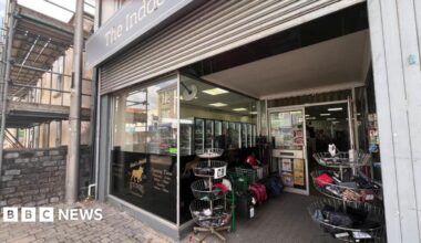 The photo shows the front of Mark's Mobile Butchers in Kingswood. Shutters can be seen above the shop window.