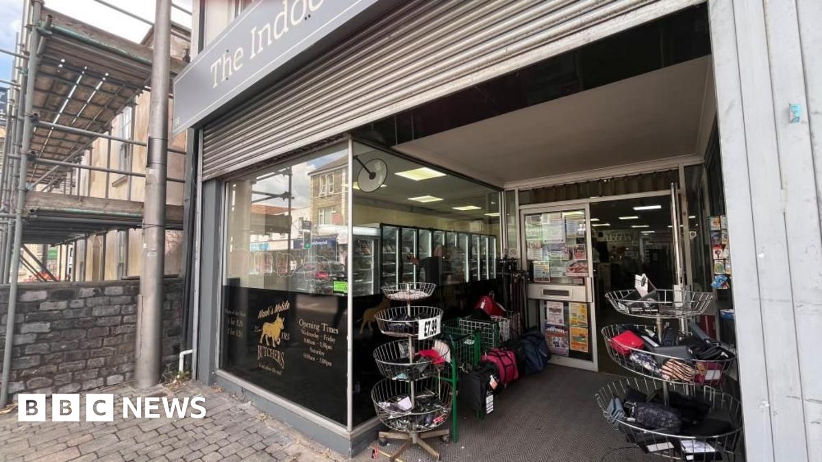 The photo shows the front of Mark's Mobile Butchers in Kingswood. Shutters can be seen above the shop window.