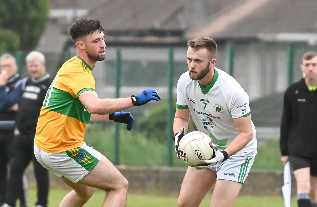 Passage's John O'Donoghue looks for support as Glanmire's James Crowley closes in, during their Division 1 Football League final, at Ballinlough. The Seandún Division is the only one in Cork with its own grounds. Picture: David Keane