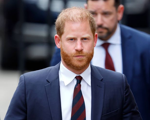 Photo of Prince Harry, dressed in a dark navy suit, attending a court hearing in London