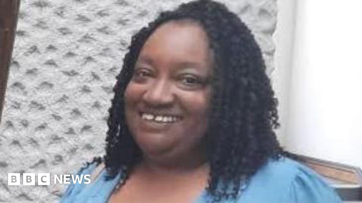 Sheffield foster carer Marcia Grant, a woman with black braided hair wearing a blue shirt.