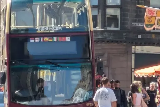 A man has been hit by a bus on a busy Edinburgh street.