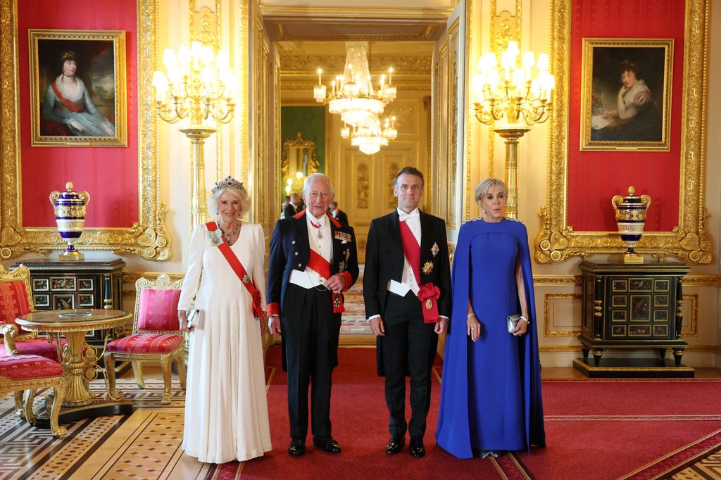 Britain's King Charles III and Britain's Queen Camilla (L) arrive with France's President Emmanuel Macron (2R) and his wife Brigitte Macron to a State Banquet 