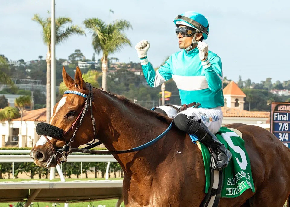 Hector Berrios celebrates the victory by Thought Process in the San ClementeBenoit photo