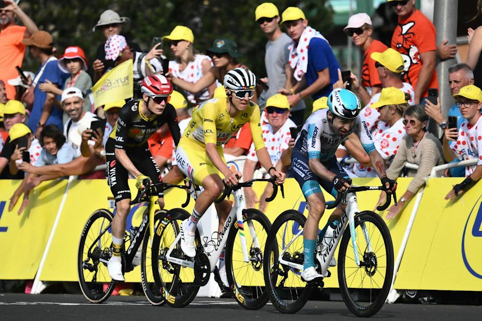 Pogacar and Vingegaard rode across the line together on stage 10 (along with Lenny Martinez, right) (AFP via Getty Images)