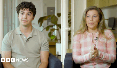 Paul Skye Lehrman and Linnea Sage, who claim their voices were stolen, sit in armchairs with neutral expressions.