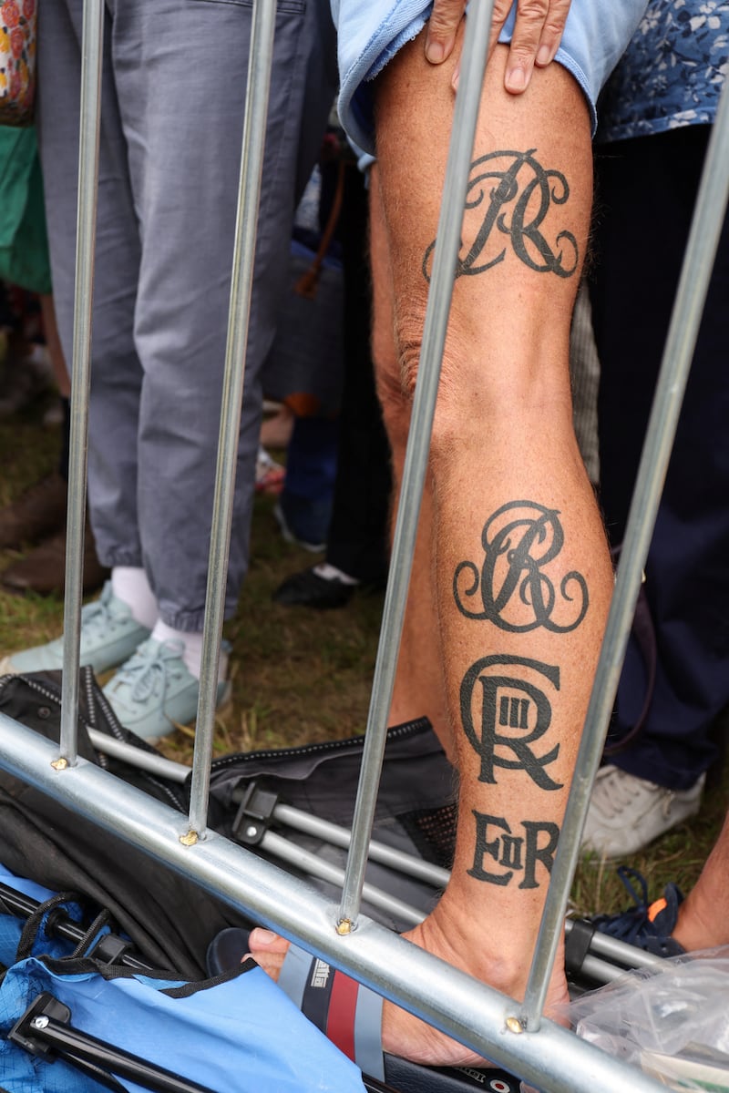 Phil Smith showed off his royal cypher tattoos to Queen Camilla at the Sandringham Flower Show.