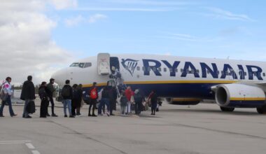 Passengers board a Ryanair plane