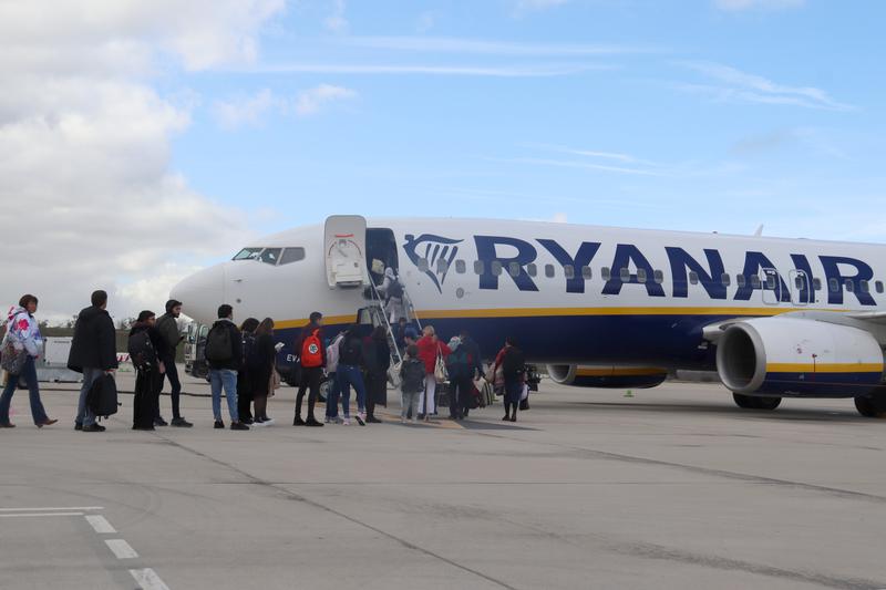 Passengers board a Ryanair plane