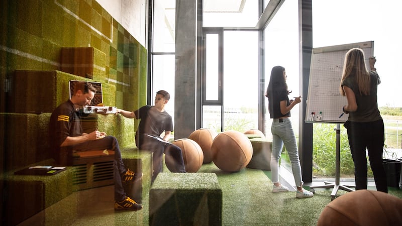Employees at work at the Adidas headquarters.
