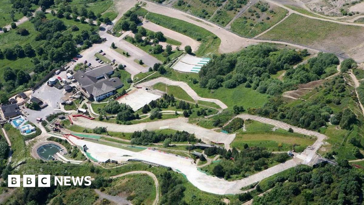 An aerial view of Sheffield's dry ski slope, which shows white slopes winding down a hill