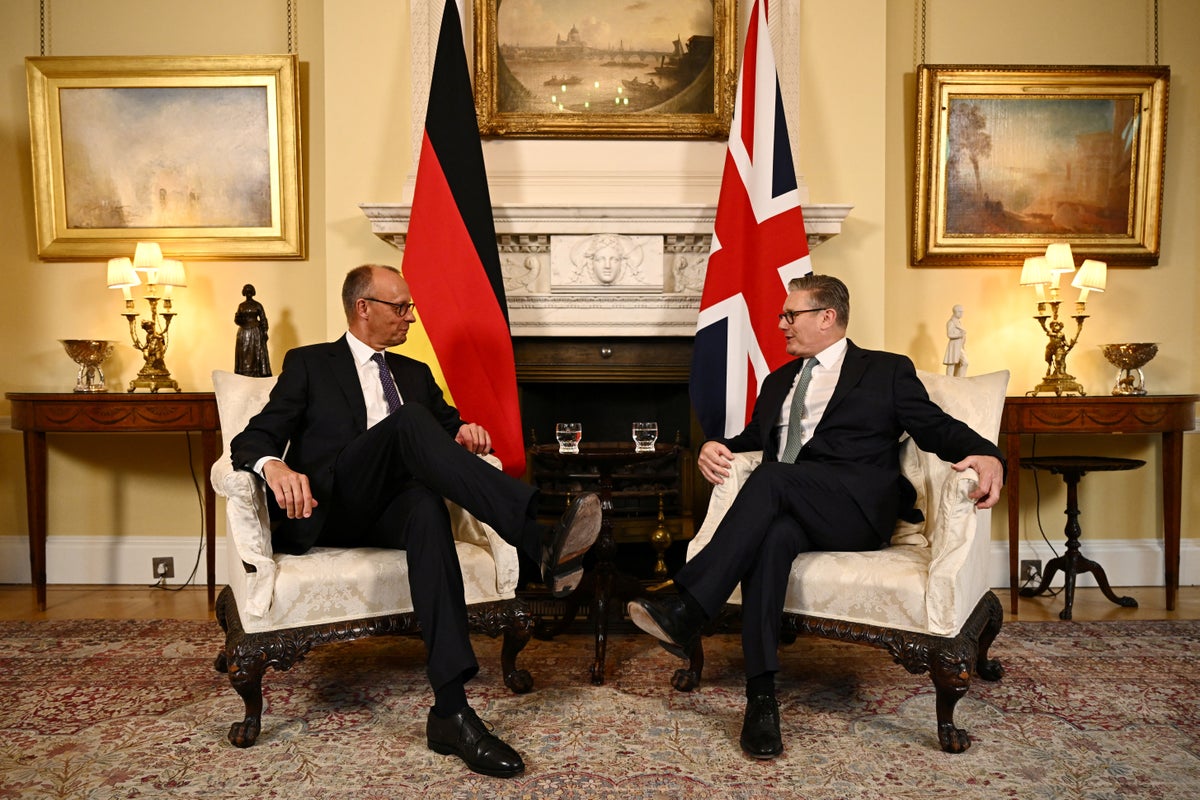 I deplore Brexit, says German chancellor, as he signs treaty with Starmer