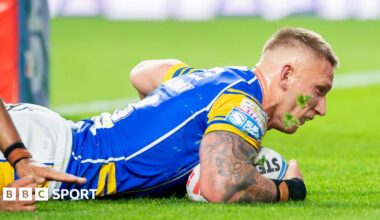Mikolaj Oledzki diving down to score a try for Leeds Rhinos in their match with Leigh Leopards
