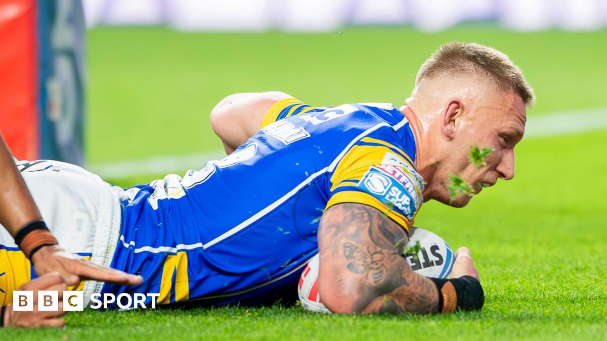 Mikolaj Oledzki diving down to score a try for Leeds Rhinos in their match with Leigh Leopards