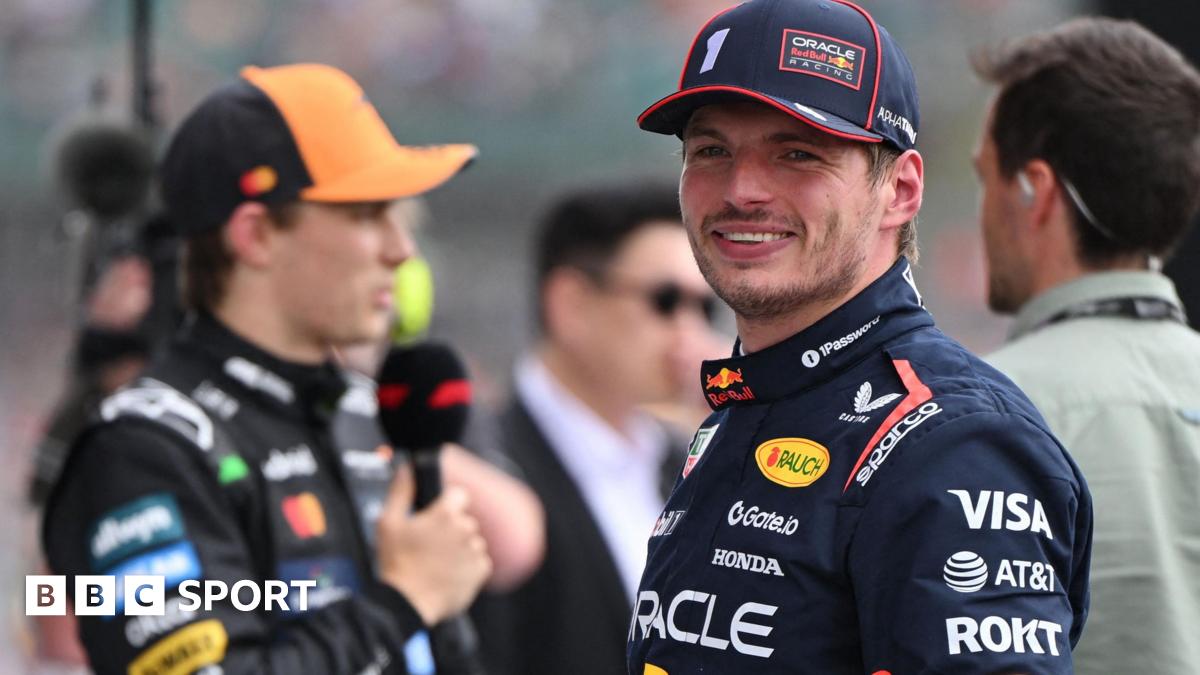 Max Verstappen smiles after taking pole for the British Grand Prix as Oscar Piastri was interviewed in the background