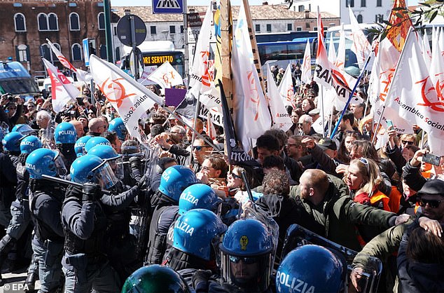 Pictured: Members of social centers confront police officers during a demonstration in Piazzale Roma against the introduction of an entrance fee to the city for day-trippers, in Venice, 2024